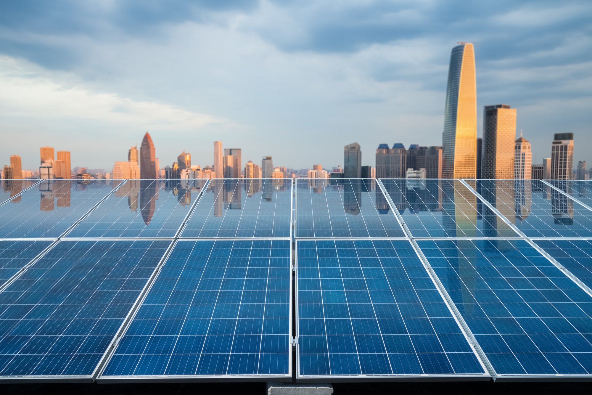 solar-energy-panel-with-city-twilight-2021-08-26-17-52-56-utc